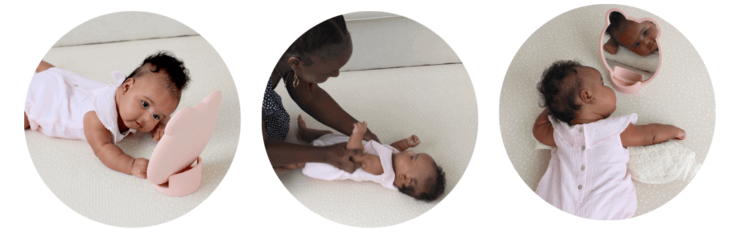 Baby practicing tummy time using a mirror