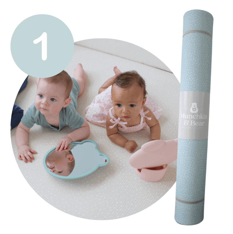 2 Babies laying on a Munchkin & Bear Play Mat with a Tummy Time mirror